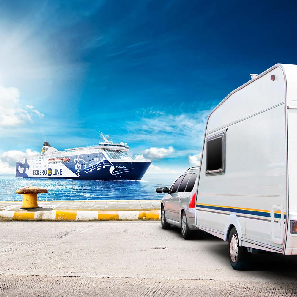 MS Finlandia arriving at the harbour with a car and caravan waiting at the dock