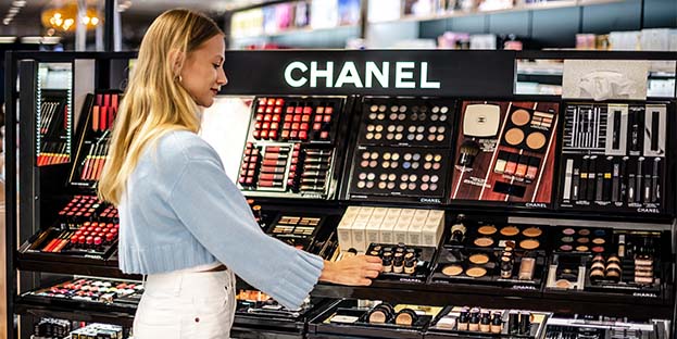 Woman choosing cosmetics at Ecker&ouml; Market & Parfymeria